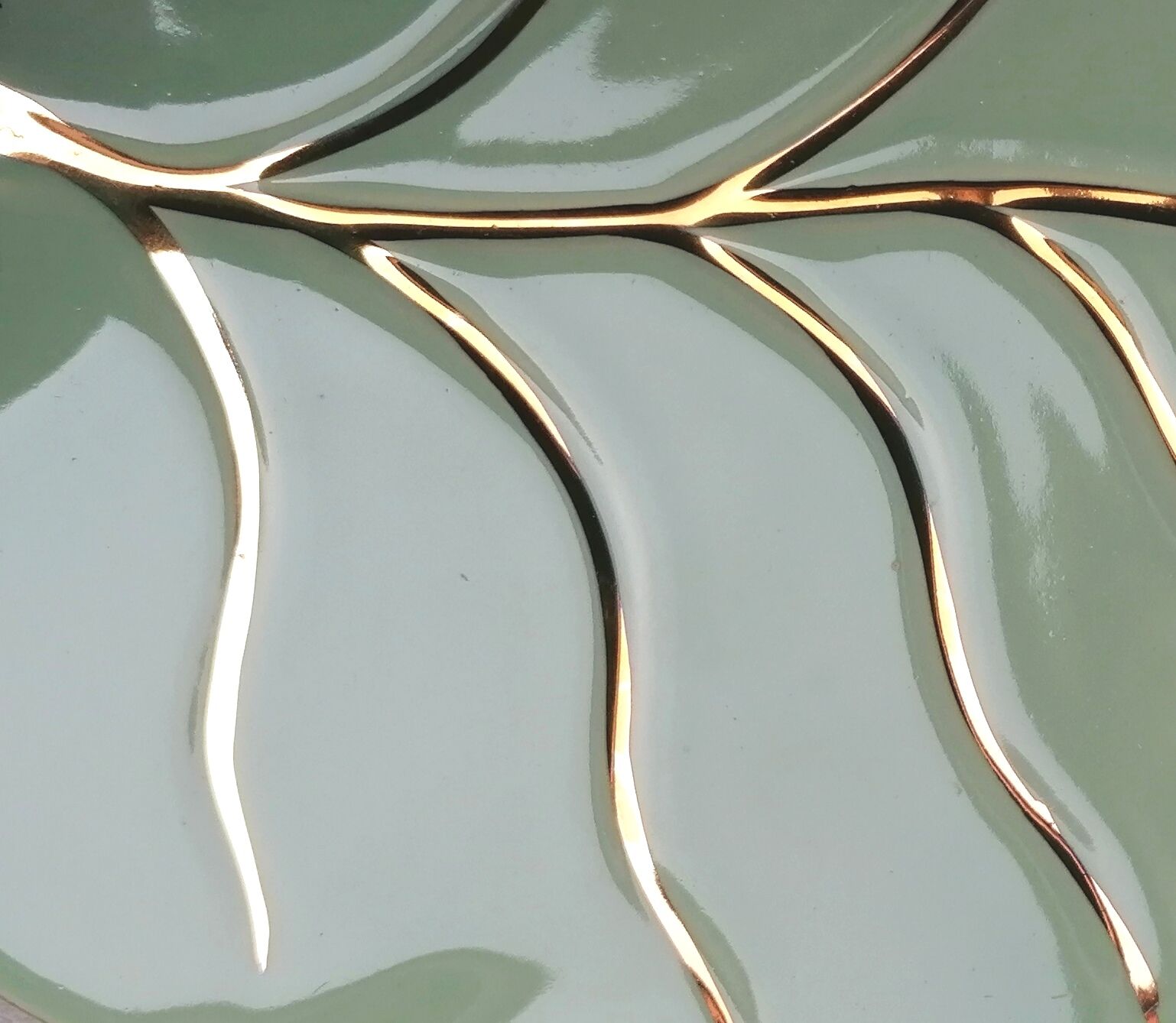 Celadon green leaf trivety and gilding