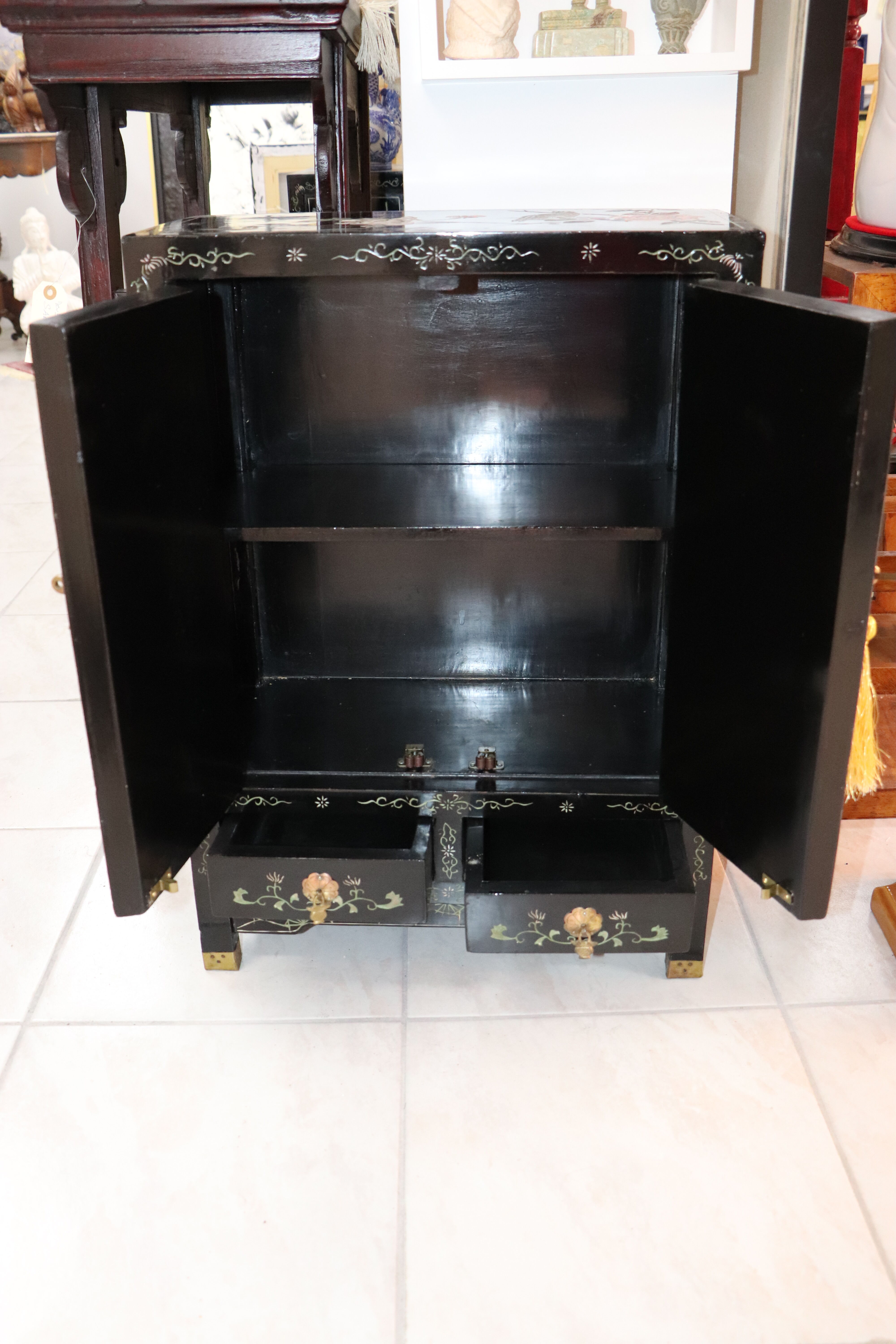 Small storage or bedside table lacquered black, incised and painted