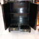 Small storage or bedside table lacquered black, incised and painted