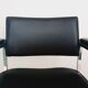 Pair of black skaï and chrome armchairs