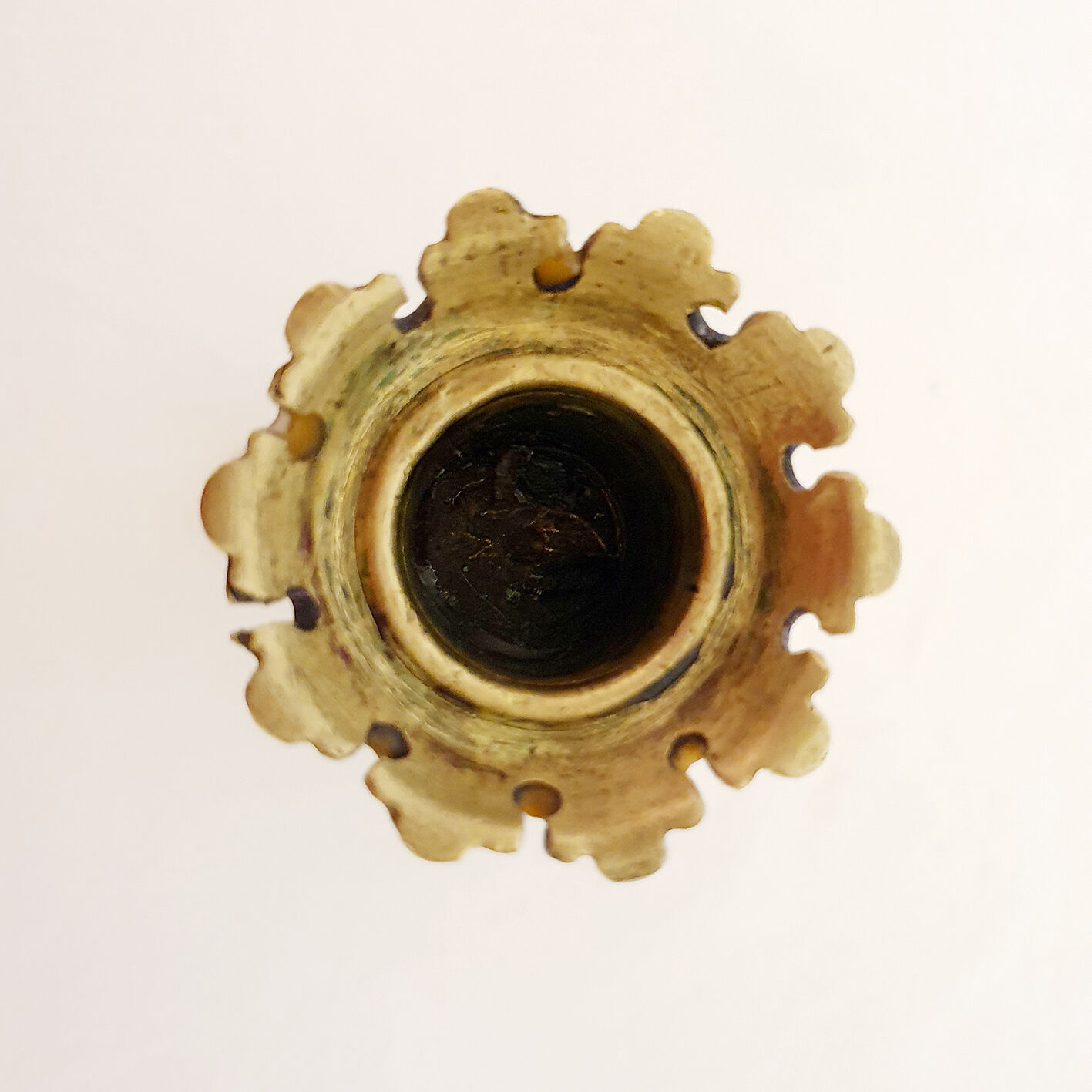 Golden candle holder with lion's head and legs