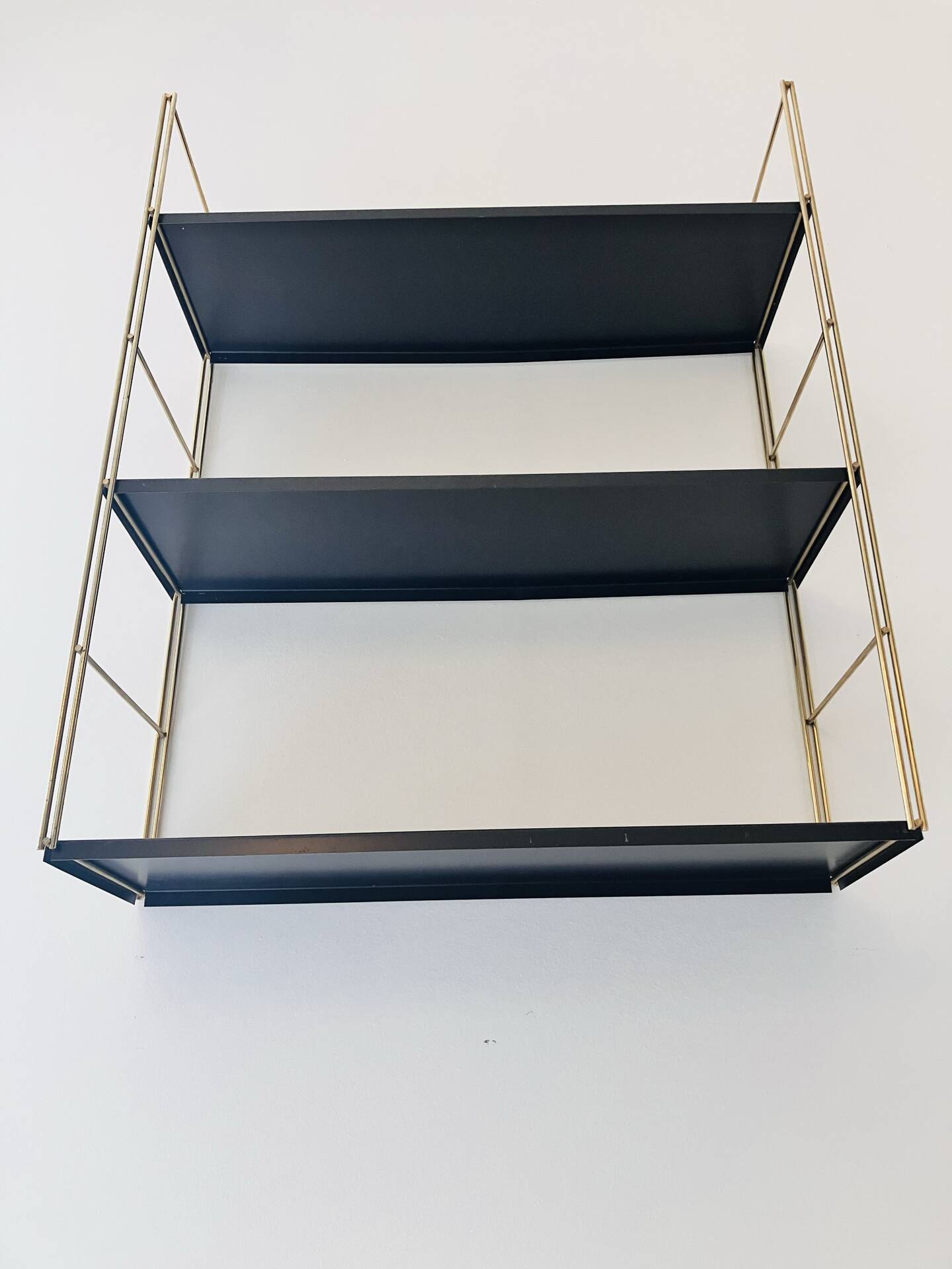 Gold and brown String wall shelves