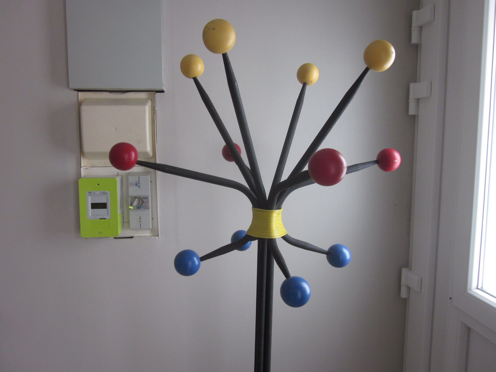 Vintage coat holder has 12 balls
