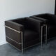 Pair of modernist brown leather armchairs