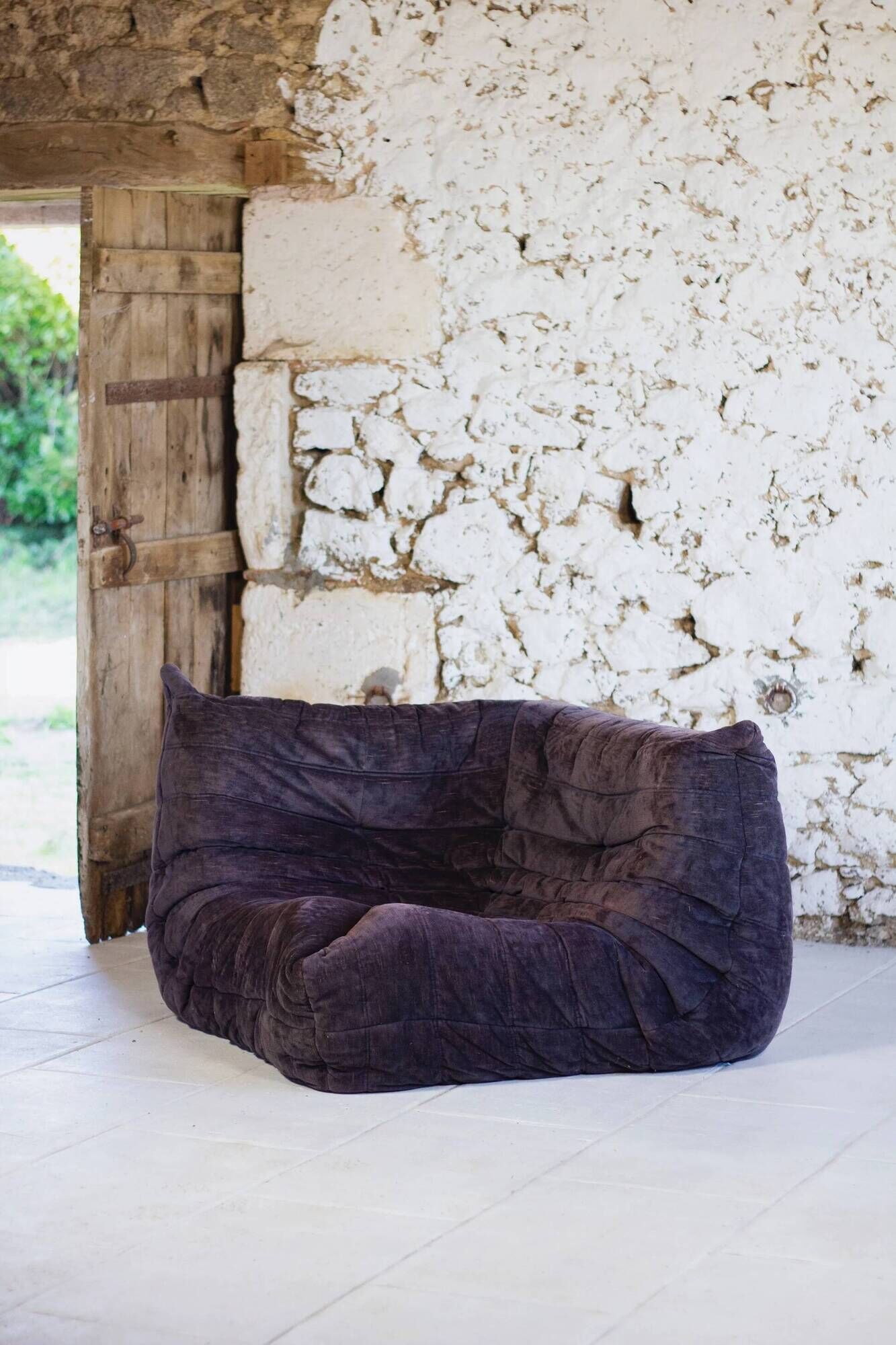 Togo aubergine corner armchair by Michel Ducaroy for Ligne Roset