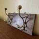 Patinated wood and metal coat rack from the 1950s.