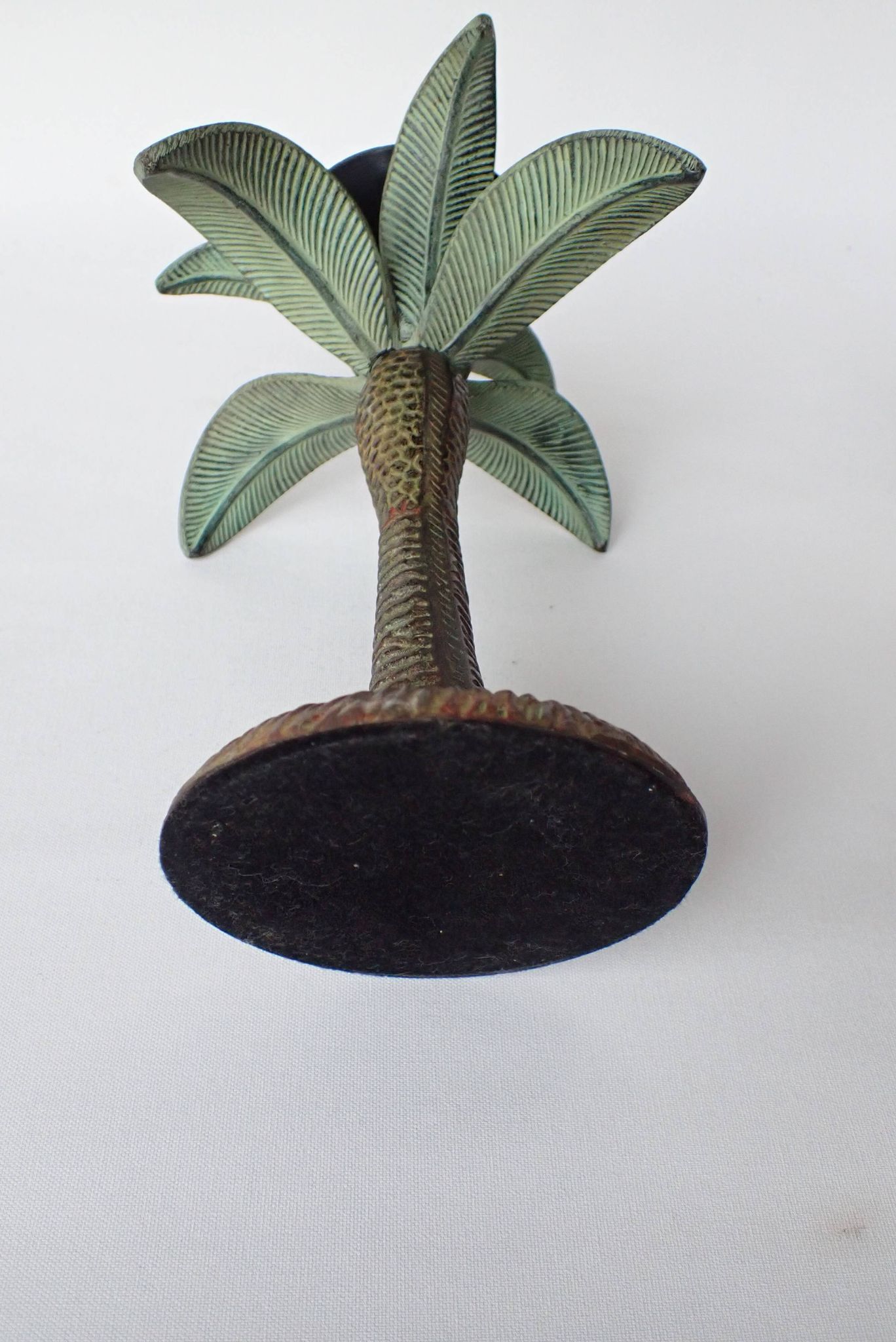 Antique palm tree-shaped candlestick in patinated metal