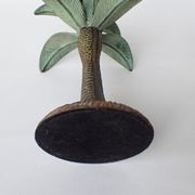 Antique palm tree-shaped candlestick in patinated metal
