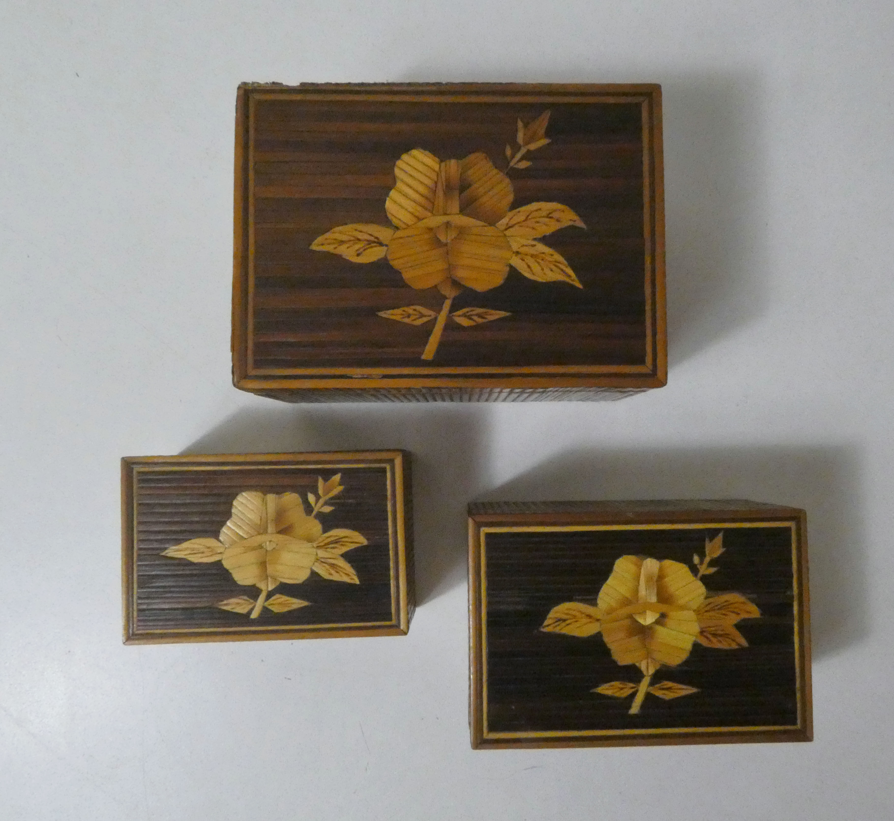 Old trundle boxes in straw marquetry