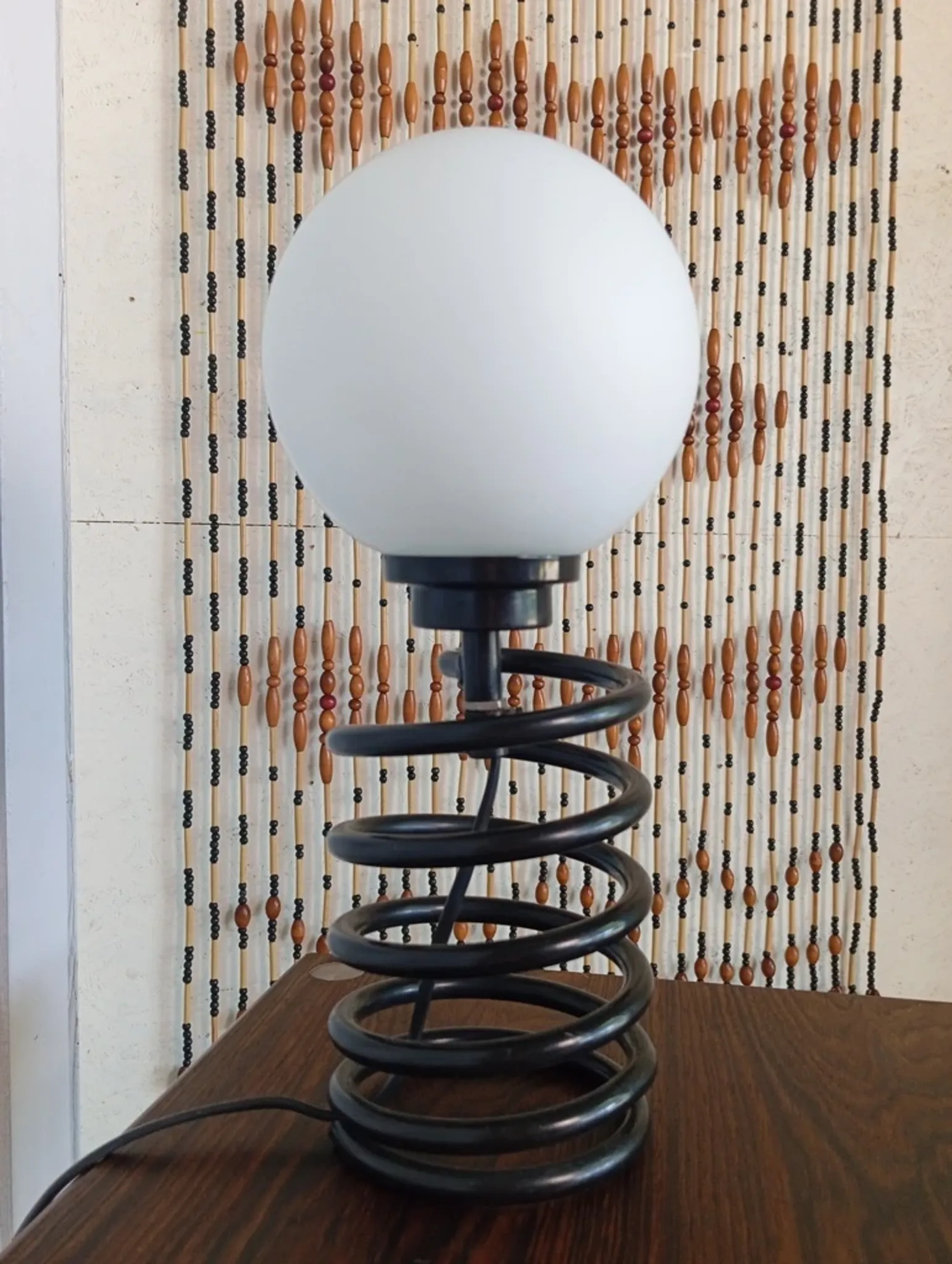 Spring lamp from the 1980s, design by Ingo Maurer.