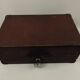 Old wooden suitcase with a padlock