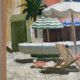 Beach scene with umbrellas, oil on cardboard 1960
