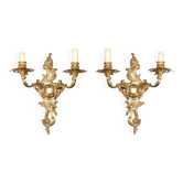 Pair of antique bronze wall sconces with candle holders from the 1920s.
