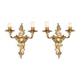 Pair of antique bronze wall sconces with candle holders from the 1920s.
