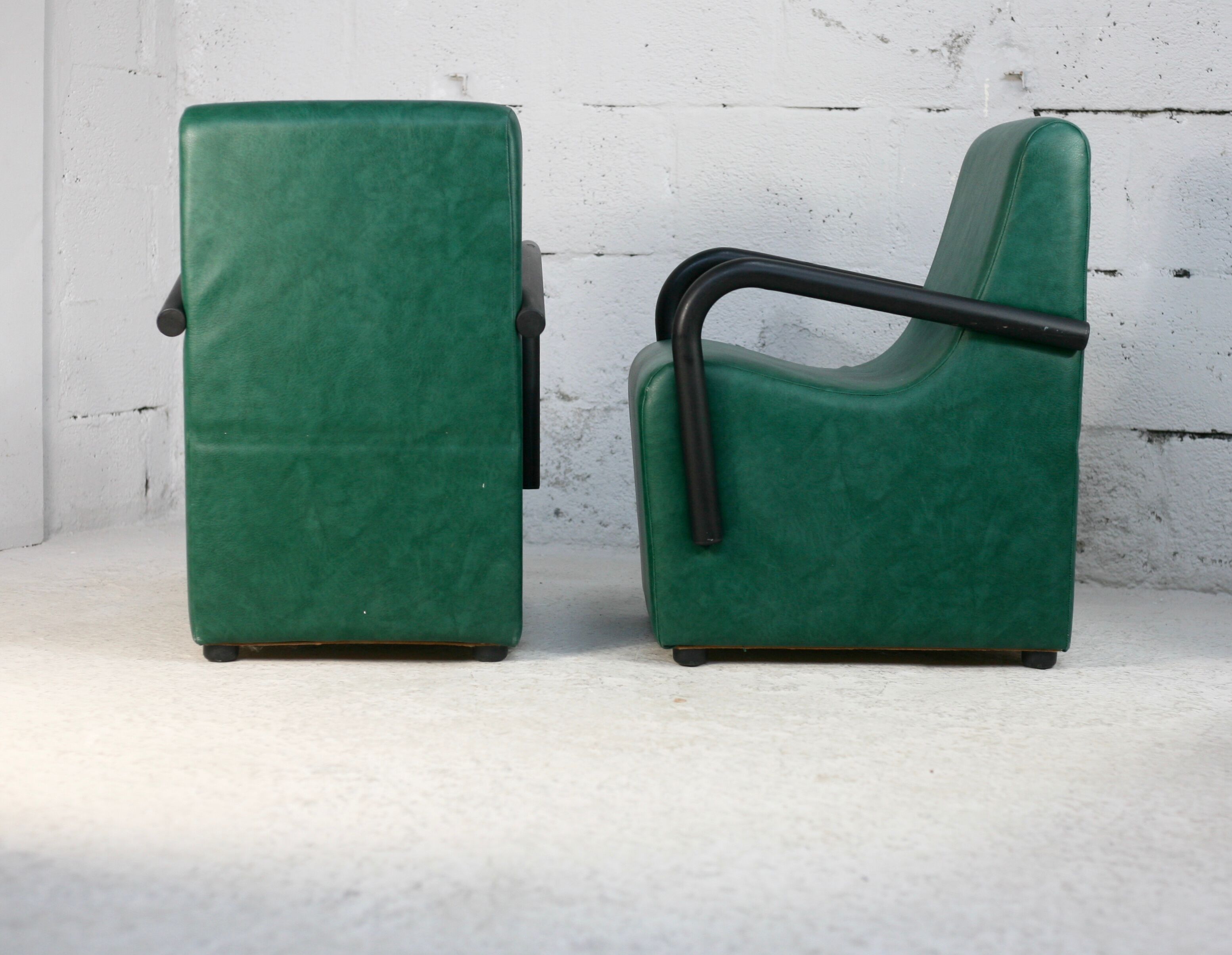 Pair of armrest heaters. Steel and green imitation leather. France, circa 1980