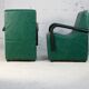 Pair of armrest heaters. Steel and green imitation leather. France, circa 1980