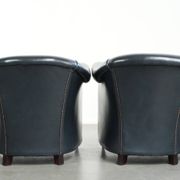 Set of dark blue cow leather club armchairs with a unique design