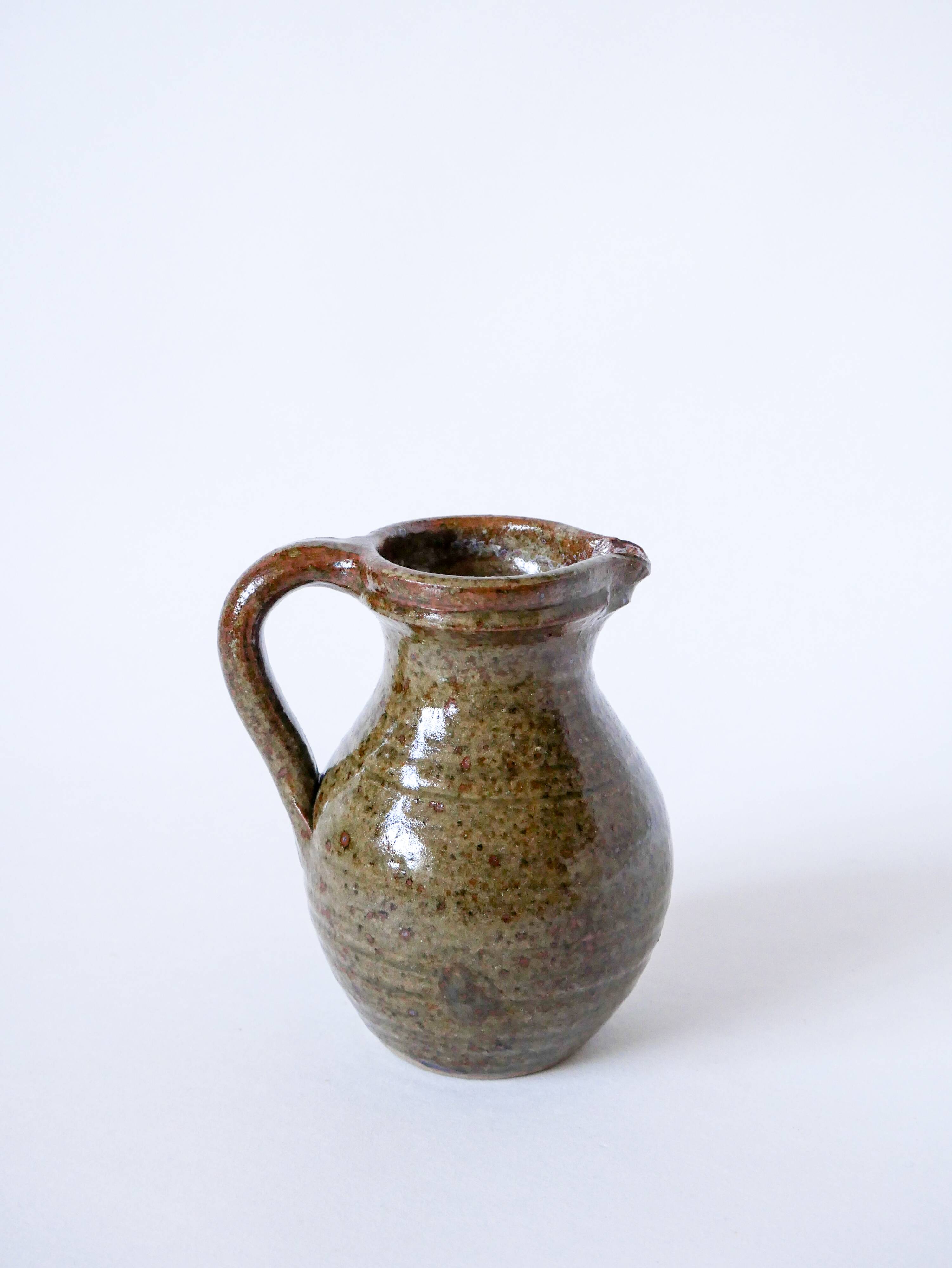 Small pitcher in dark brown glazed stoneware 1970