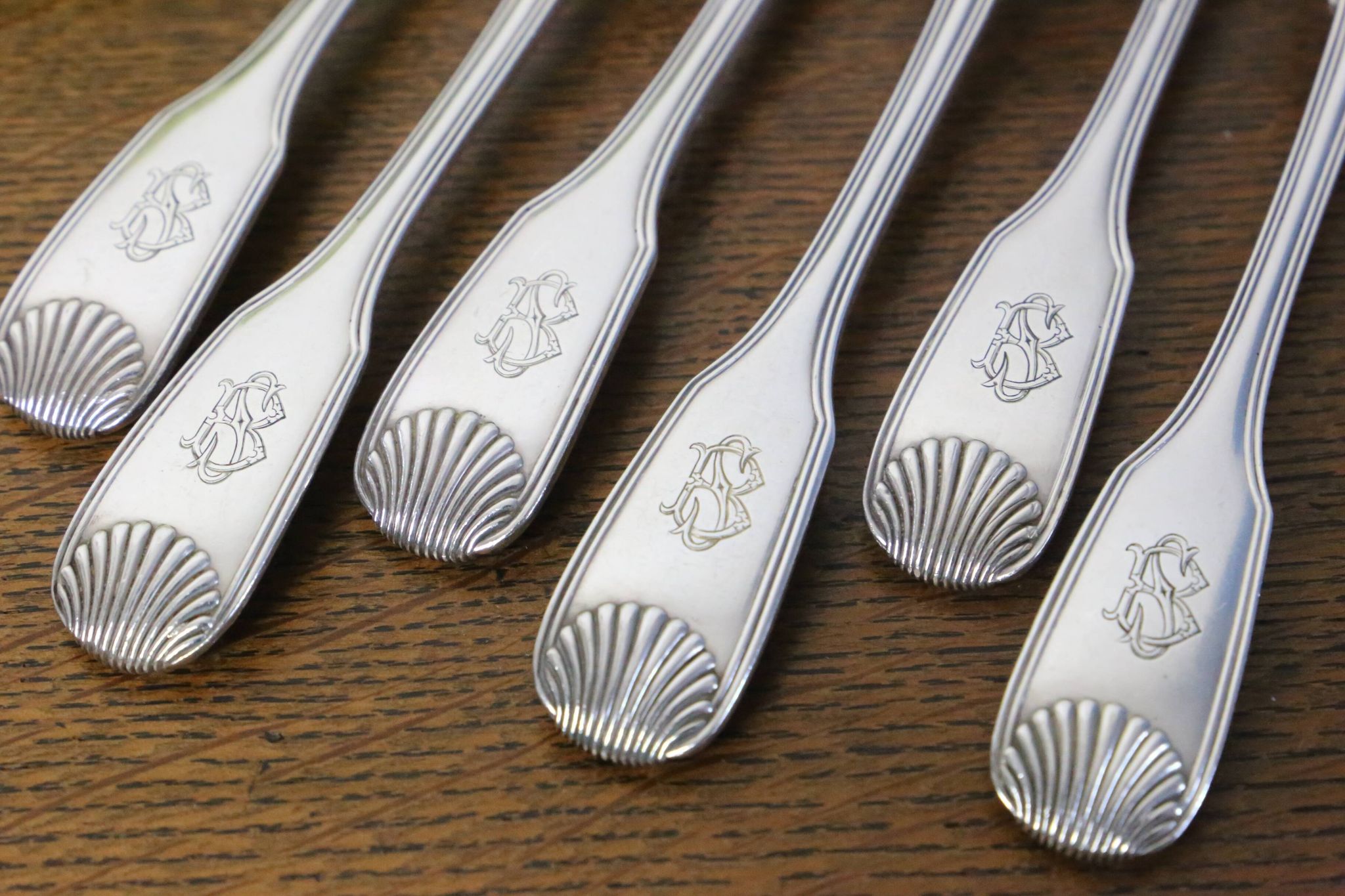 Set of 6 Cailar Bayard dessert forks, Coquille, monogrammed, early 20th century