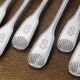 Set of 6 Cailar Bayard dessert forks, Coquille, monogrammed, early 20th century