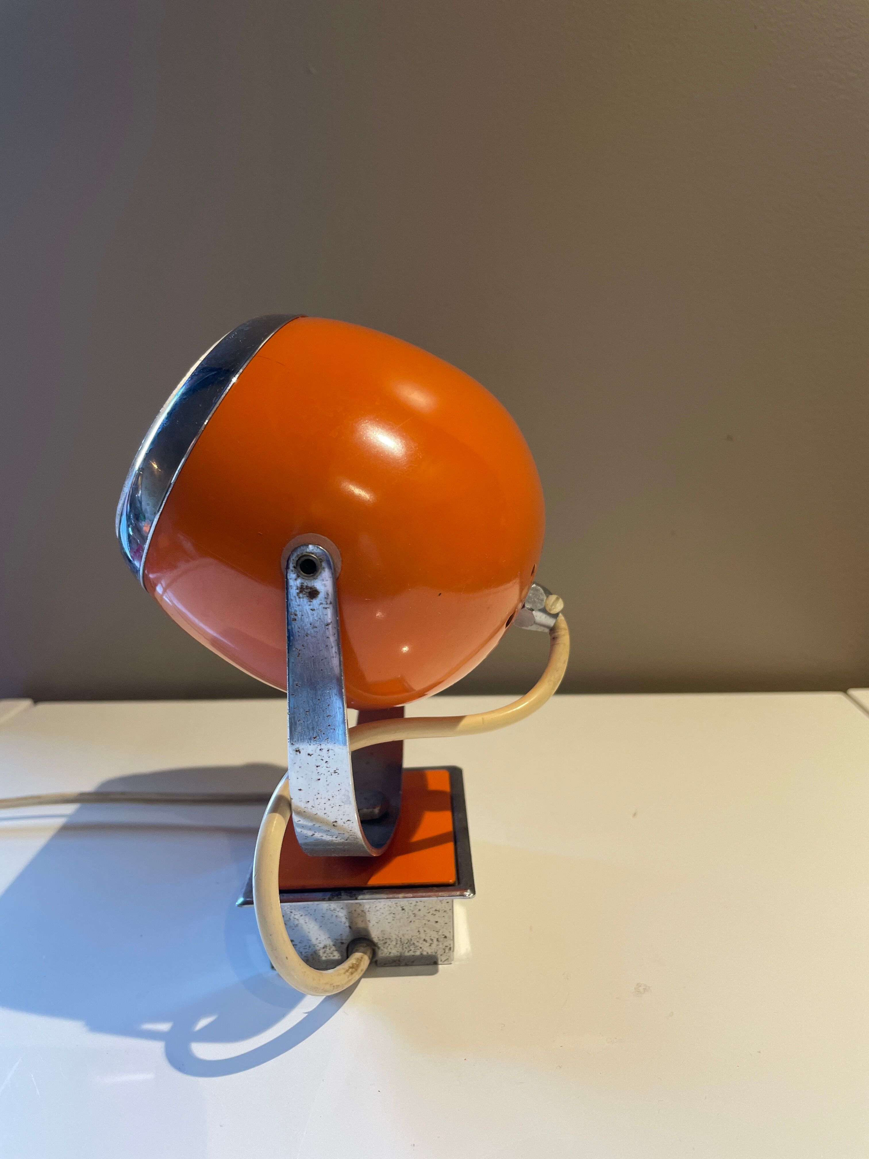 Orange eye ball wall lamp
