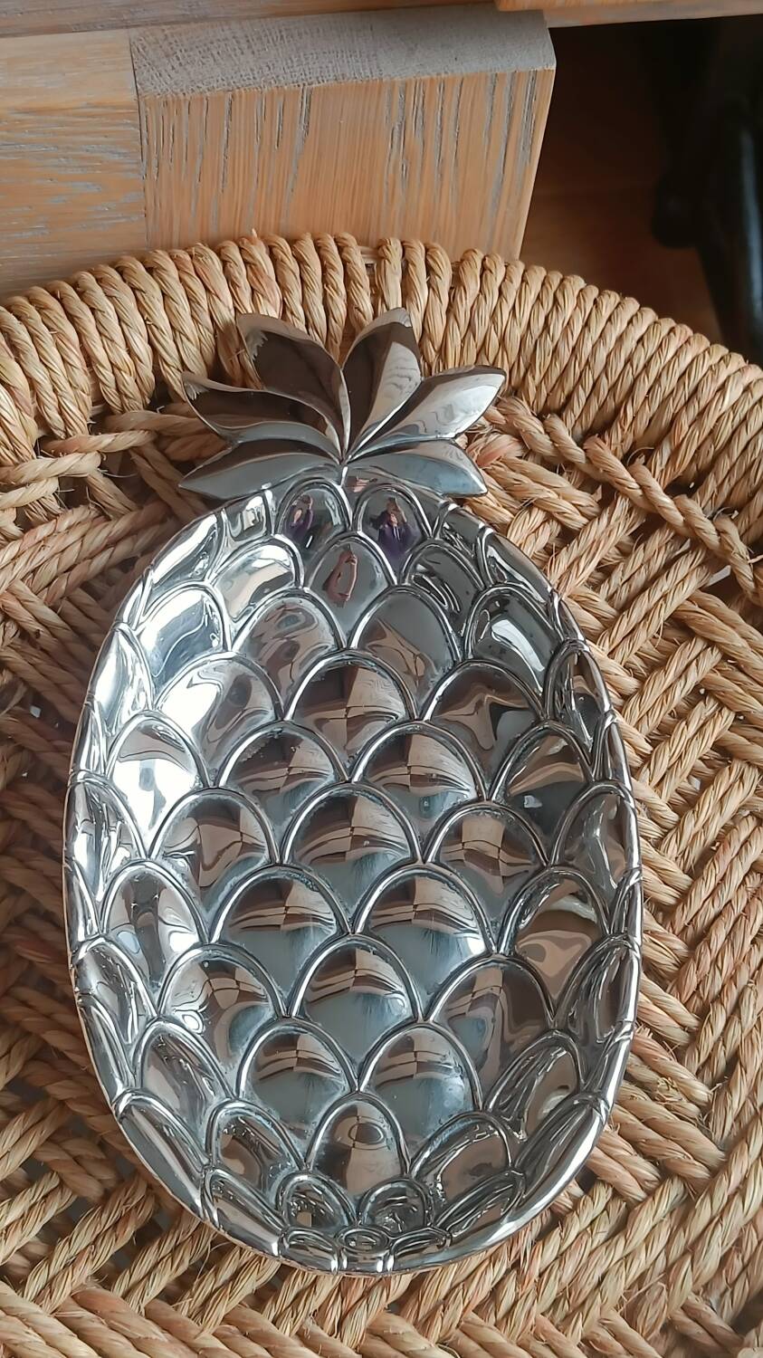Silver-plated metal tray in the shape of a pineapple.