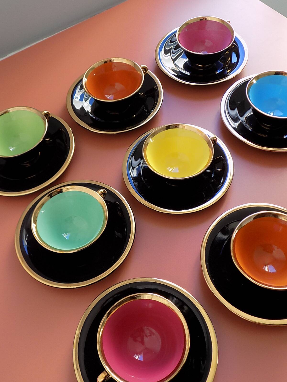 set of 9 black and gold Salins cups and saucers