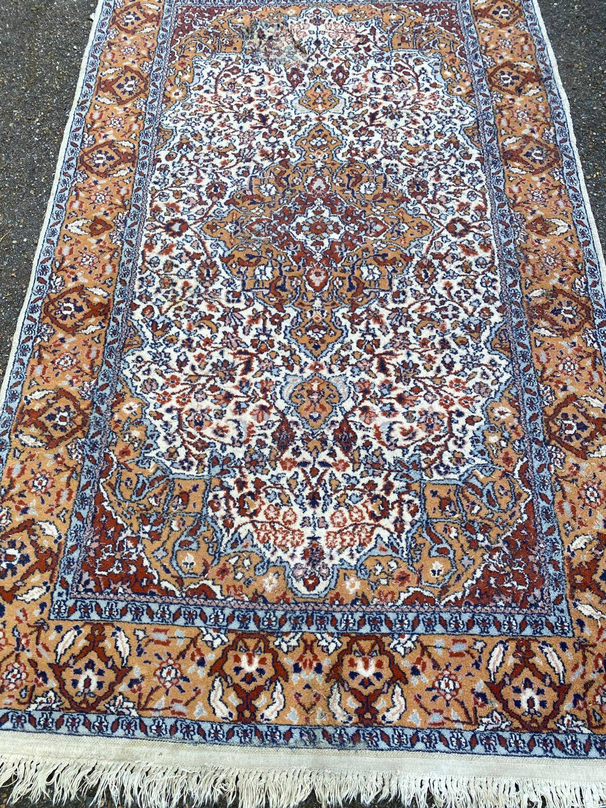 Handmade Persian rug in blue, beige, burgundy, and orange, 95x160cm.