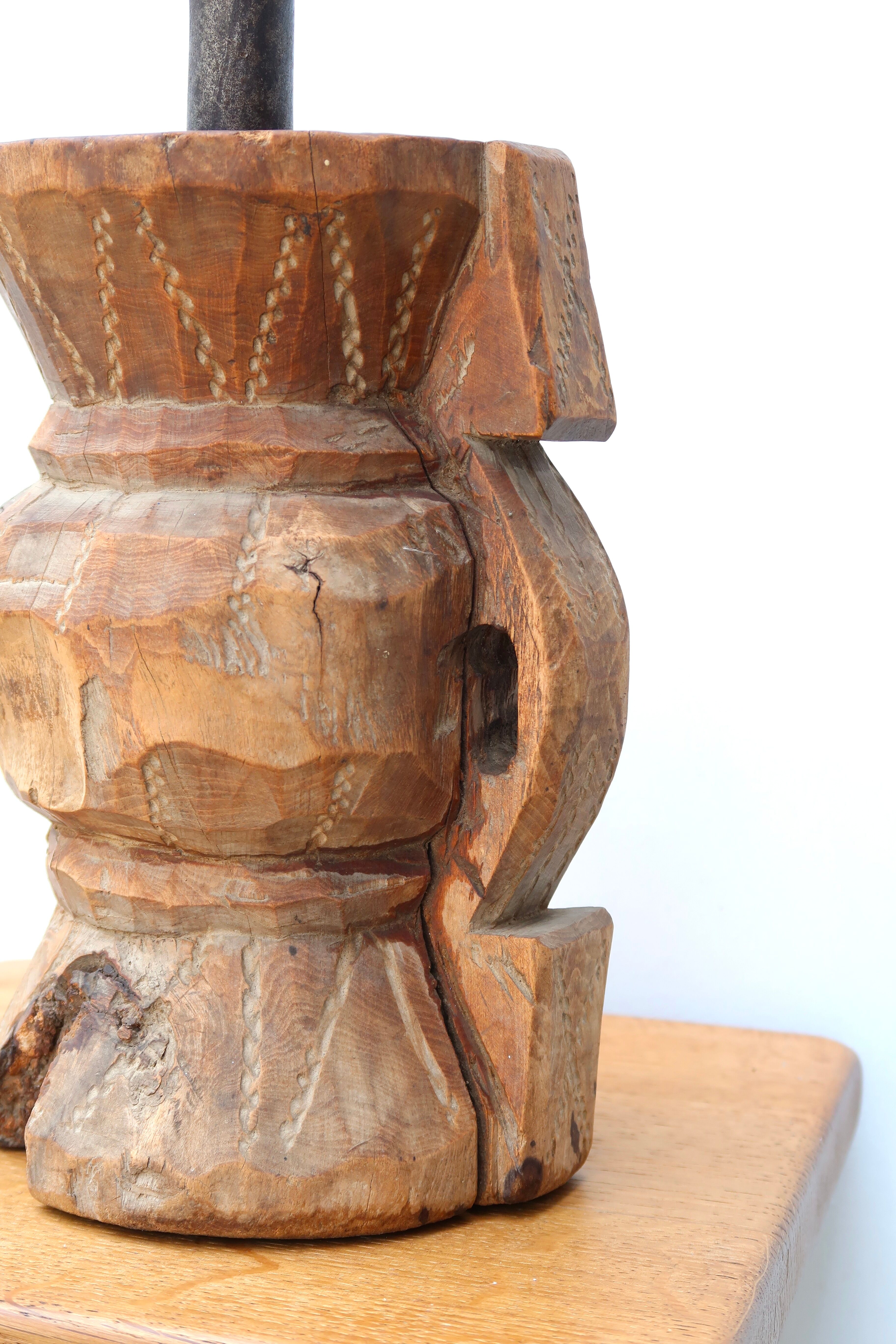 African mortar in carved wood, cast iron pestle, 70s