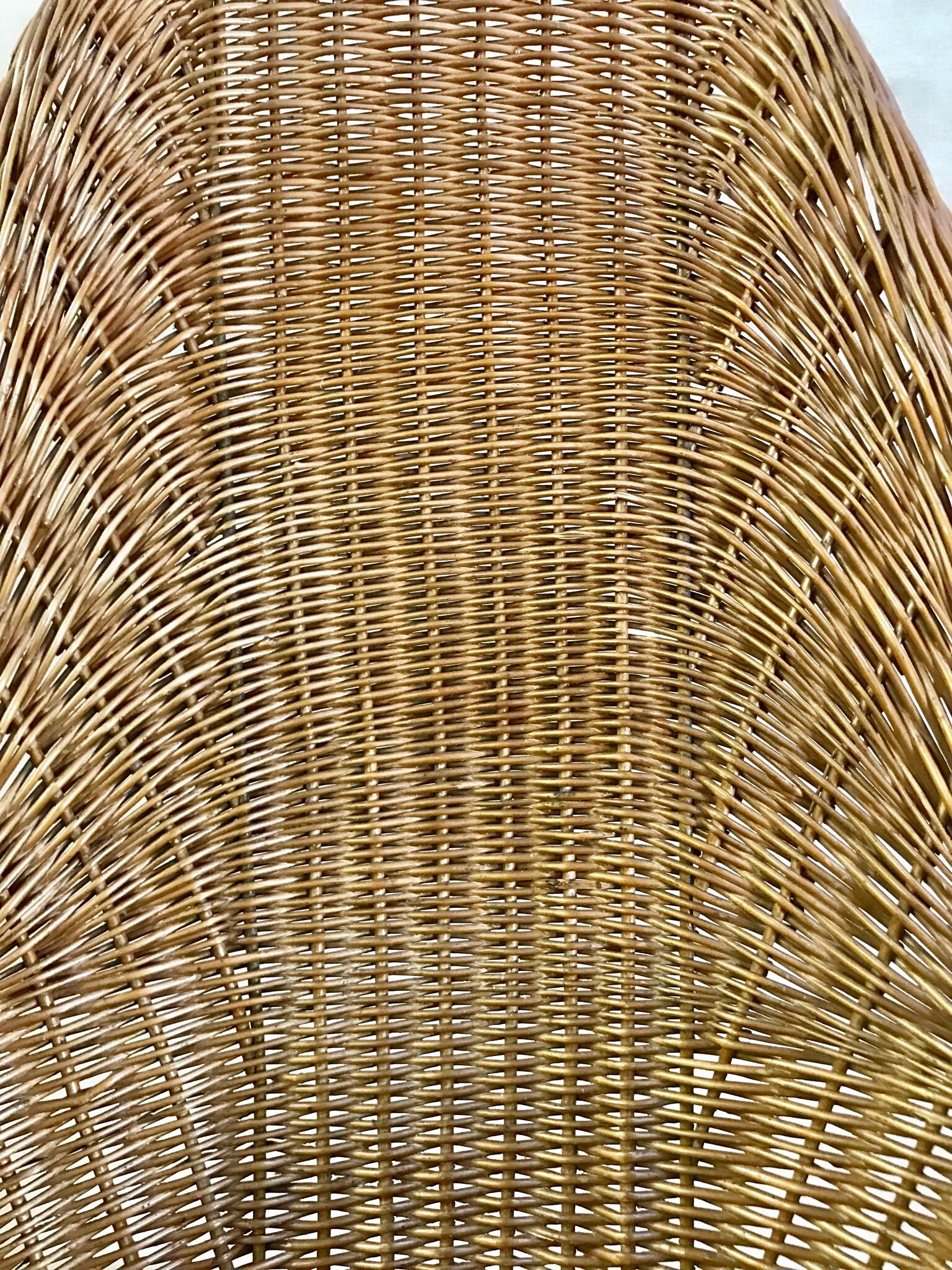 High-backed chair or shepherdess in vintage wicker