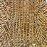 High-backed chair or shepherdess in vintage wicker