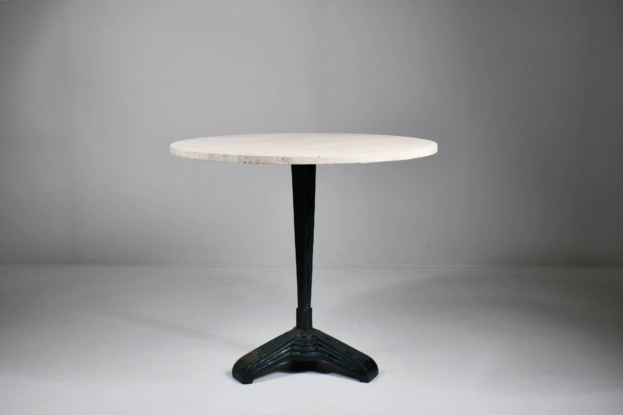 Vintage travertine bistro/dining table with metal base. (B)