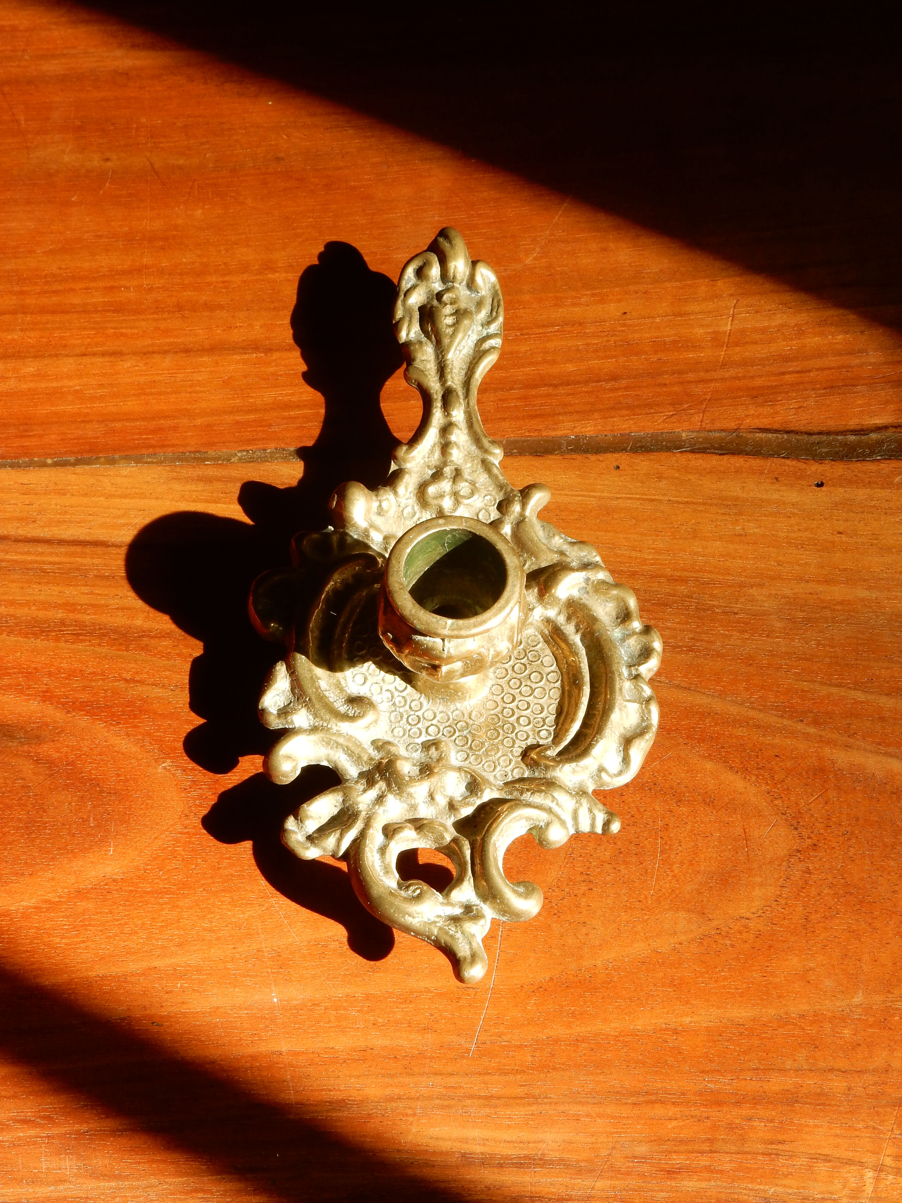 Bronze hand candle holder, cellar rat