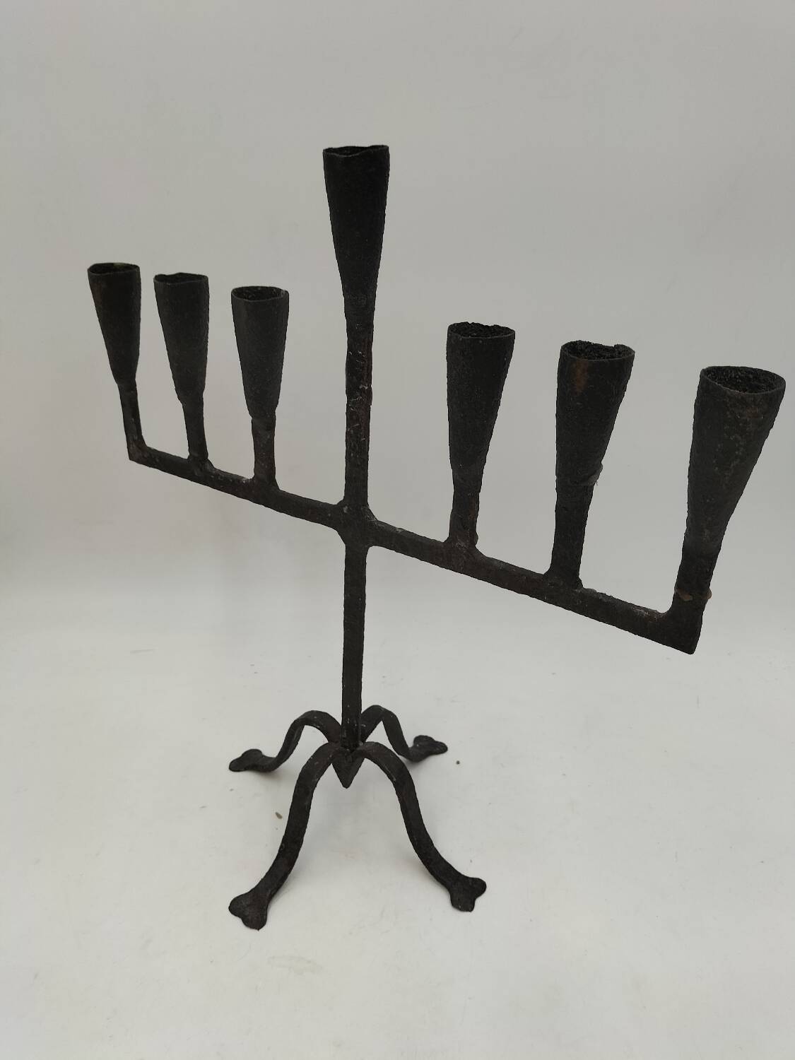 Brutalized wrought iron candle holder
