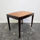 Vintage wooden ottoman from the 1940s with a silk top and studded trim.
