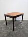 Vintage wooden ottoman from the 1940s with a silk top and studded trim.