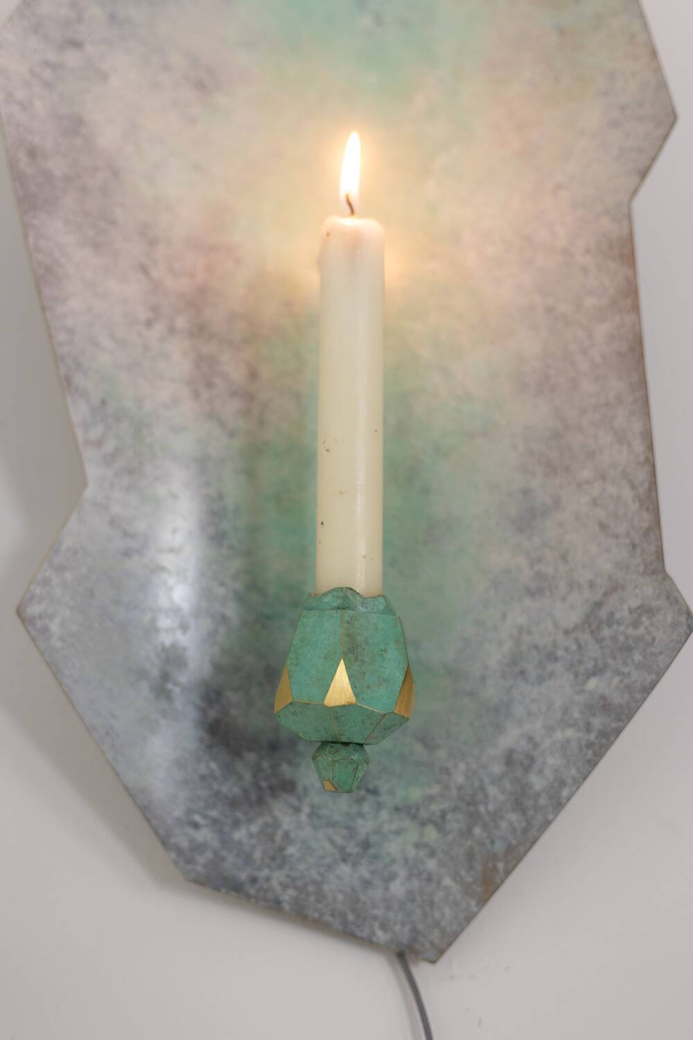 Pair of brass and bronze wall-mounted candlesticks. Contemporary work by an artist.