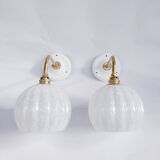 Brass and speckled glass wall lights from Clichy