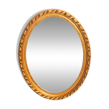 Decorative oval mirror with a floral frame, Italy, 1960s.