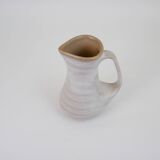 Signed white beige ceramic pitcher