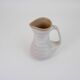Signed white beige ceramic pitcher