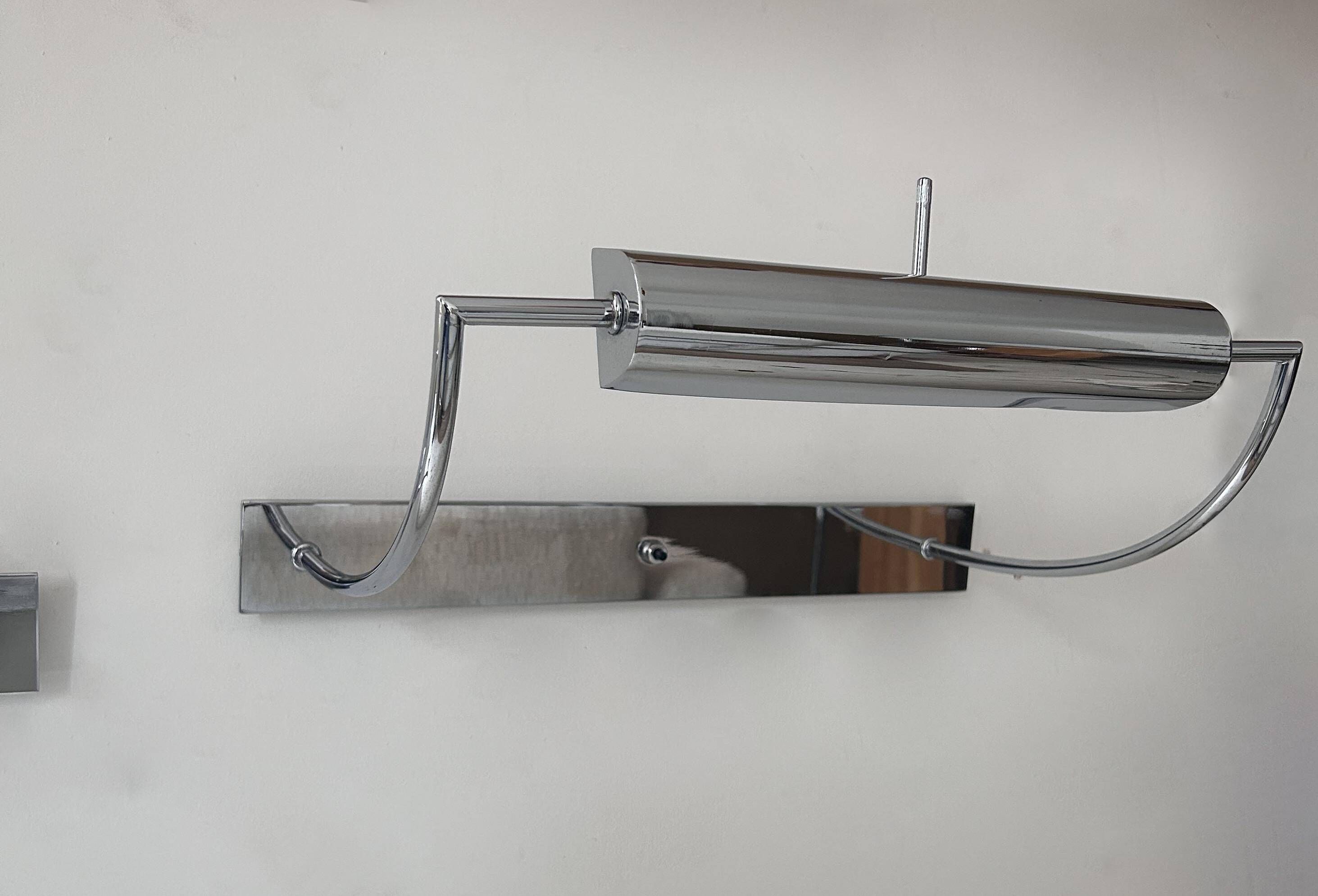 Pair of vintage adjustable wall lights, chrome metal, France 1970.