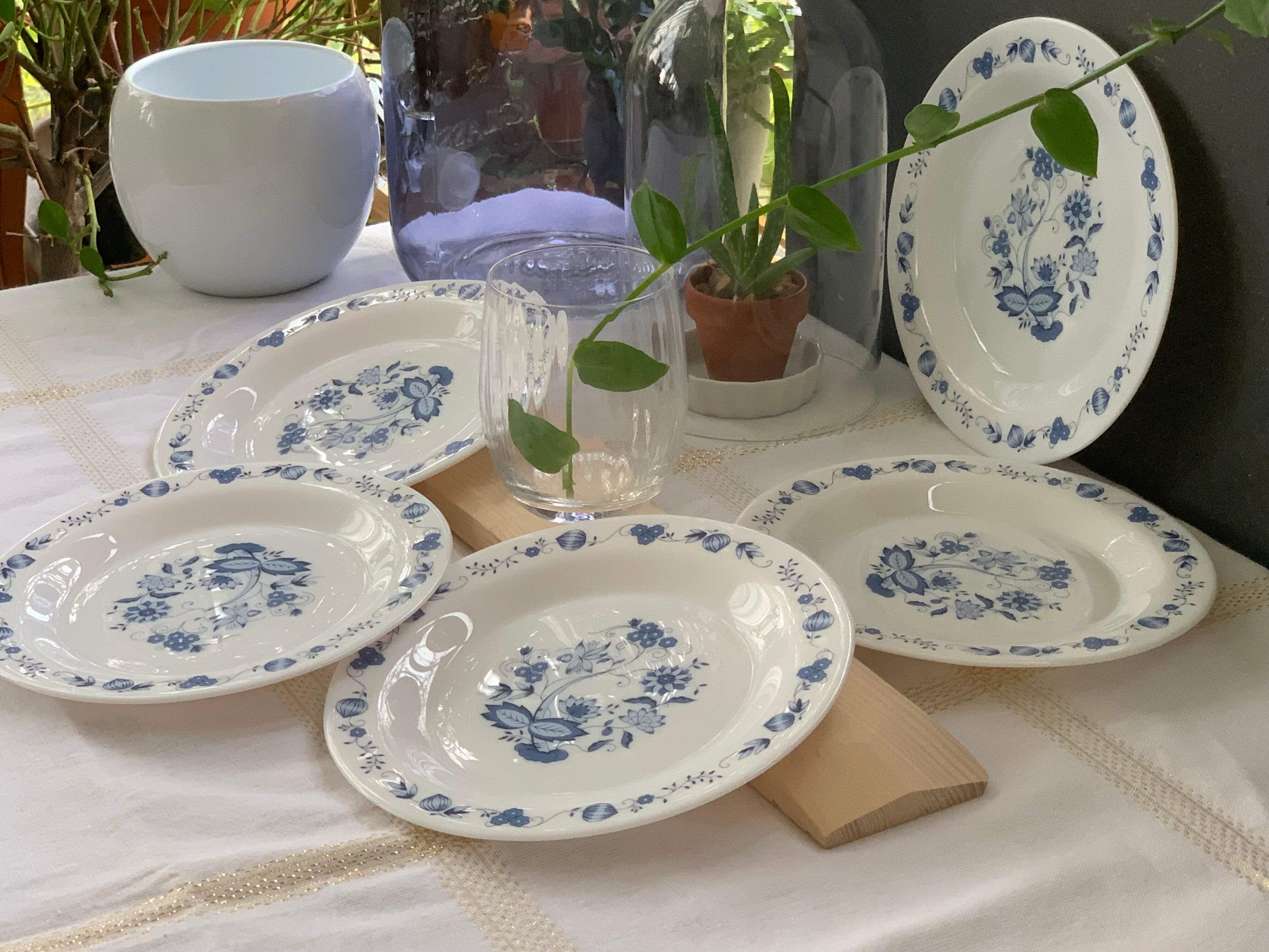 3 bowls and 5 blue plates