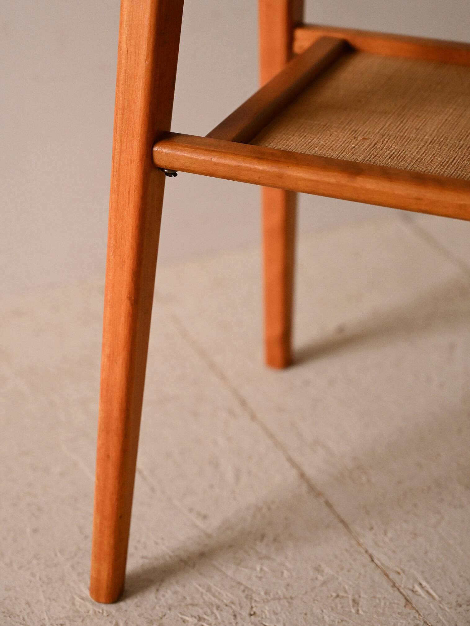 Bedside table with rattan magazine rack