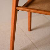 Bedside table with rattan magazine rack