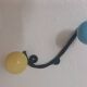 Vintage wall coat rack "Atomic" in wrought iron with multicoloured balls.