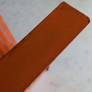 Vintage metal magazine rack in perforated orange/Mathieu Mategot style/70s