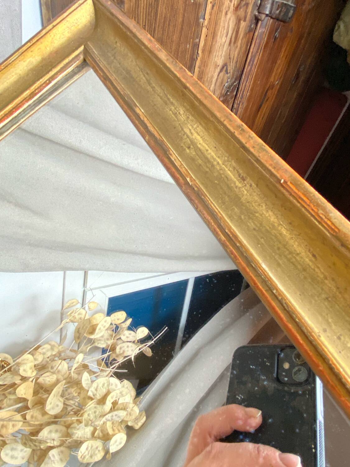 Antique mirror in gilded wood