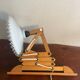Accordion wall lamp in wood and wavy opaline