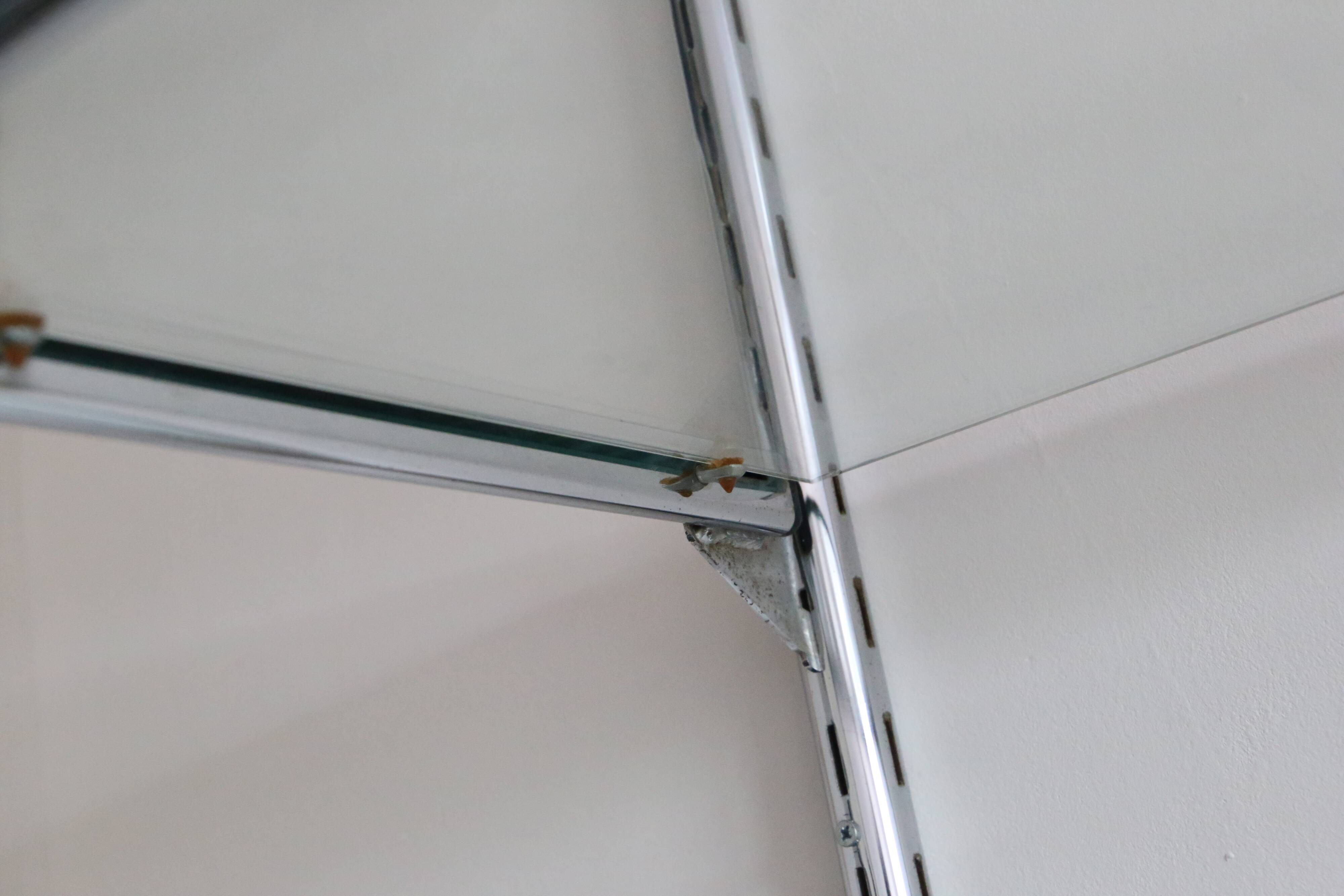 Chrome and glass wall shelf, circa 1960